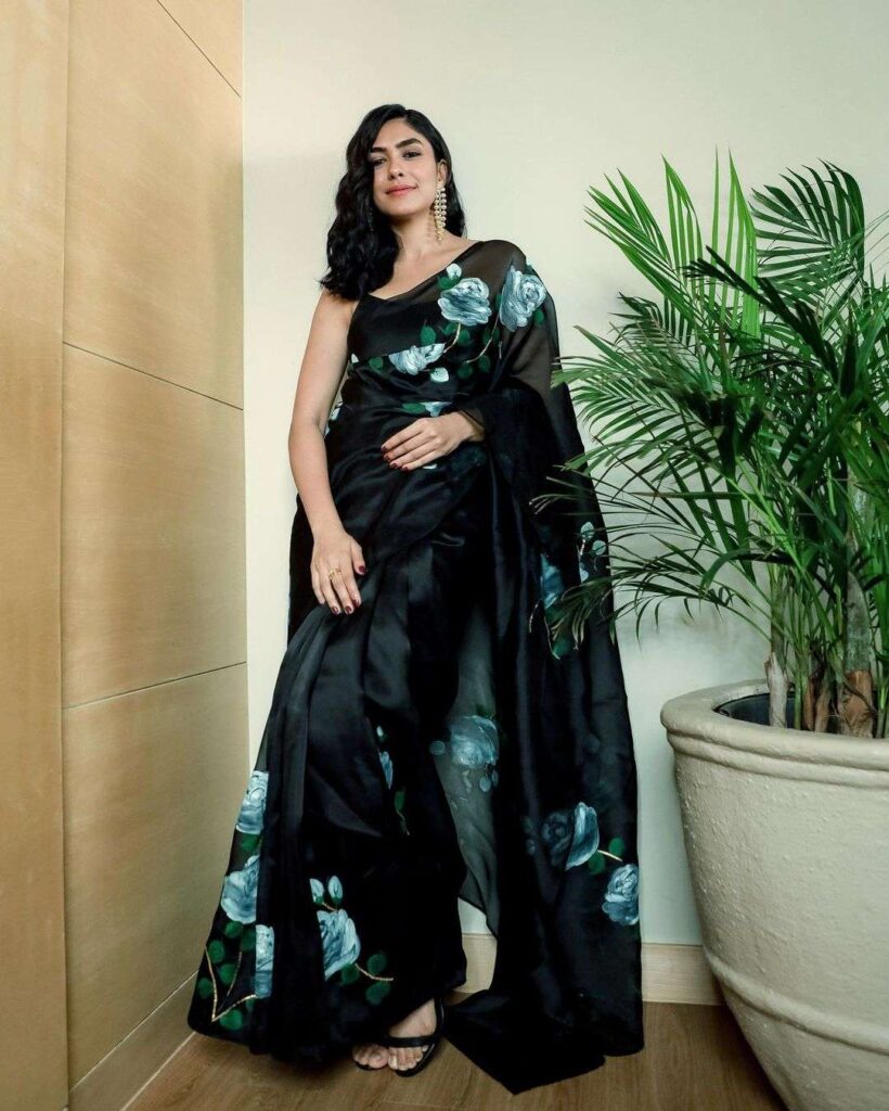 Mrunal Thakur in her Black Organza Saree with a sleeveless blouse