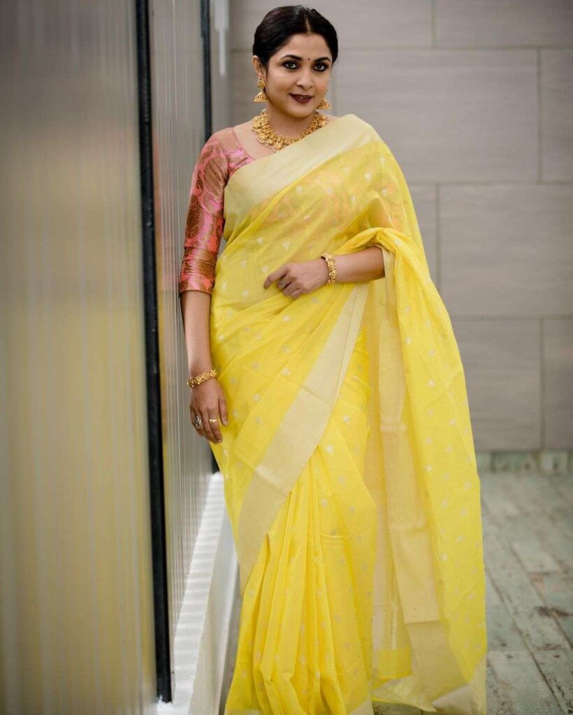 Organza Saree Blouse Ideas from Ramya Krishnan wearing a 3/4th blouse sleeve and a stunning yellow organza saree